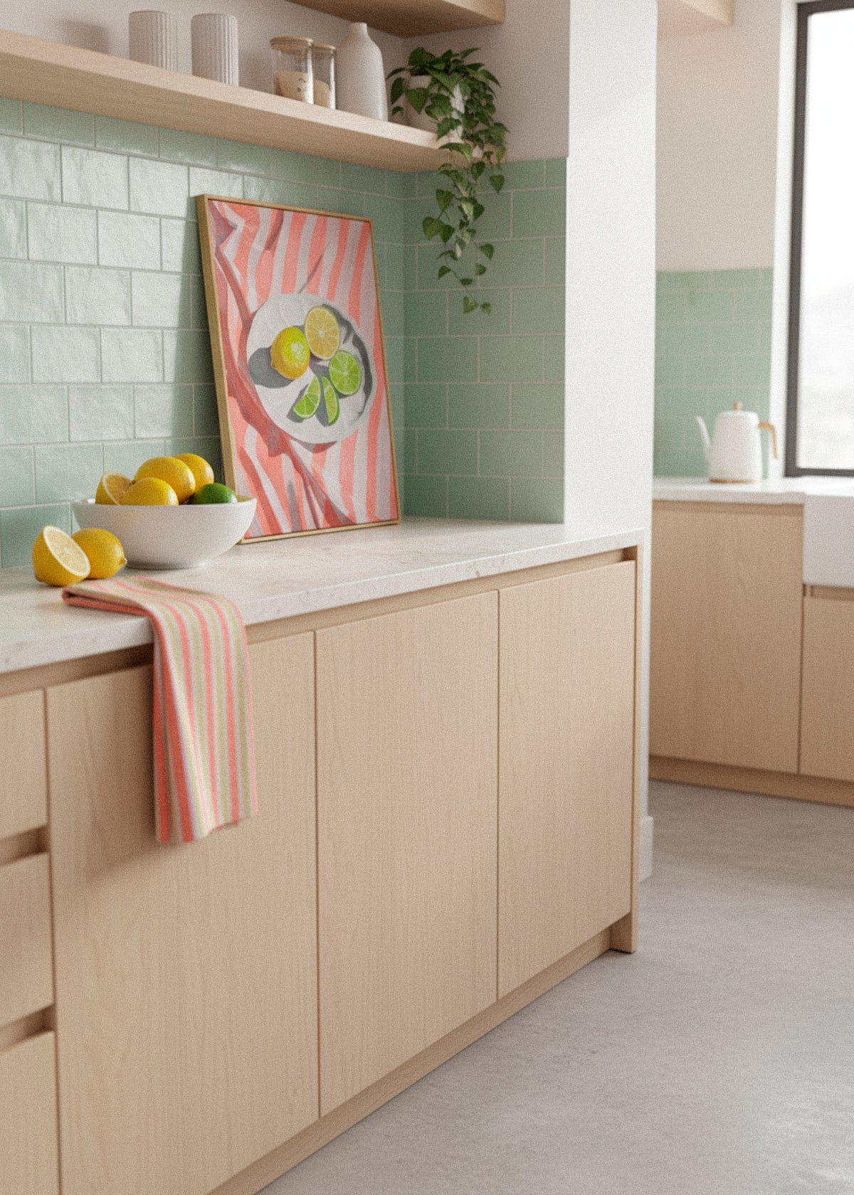A Slice of Lemon canvas print in a bright Scandinavian kitchen – citrus art with lemons and limes on a striped cloth. Styled by Hello Poster.