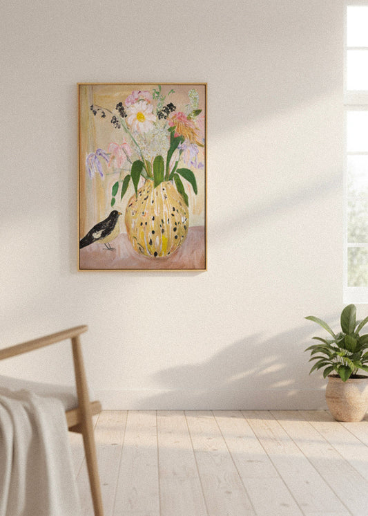 Canvas artwork with pastel floral bouquet and a small bird, styled in a bright Scandinavian living room with light wooden floors and soft natural light.
