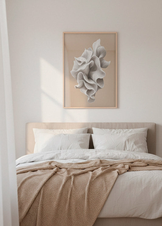 Shape No. 70 abstract line-art poster in a natural wooden frame, hanging above a soft beige bed in a light Scandinavian bedroom with warm sunlight.