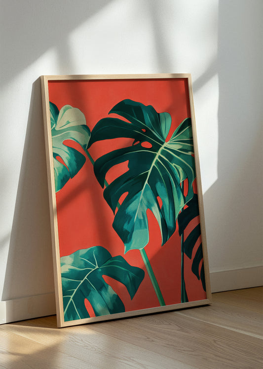 Framed Monstera poster resting on floor with sunlight and shadow play
