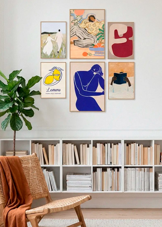Us, Lazy Days, Lemons Paris Fruit Market, Red Geometric Shapes, Minimalist Blue Silhouette Figure and Must Read posters styled as a curated gallery wall in a Scandinavian living room
