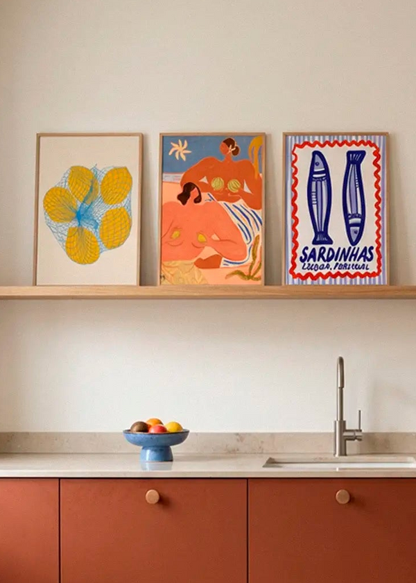 5 Lemons in a Net, Lemon and Melon and Lisbon Sardines posters styled on a kitchen shelf in a Scandinavian kitchen