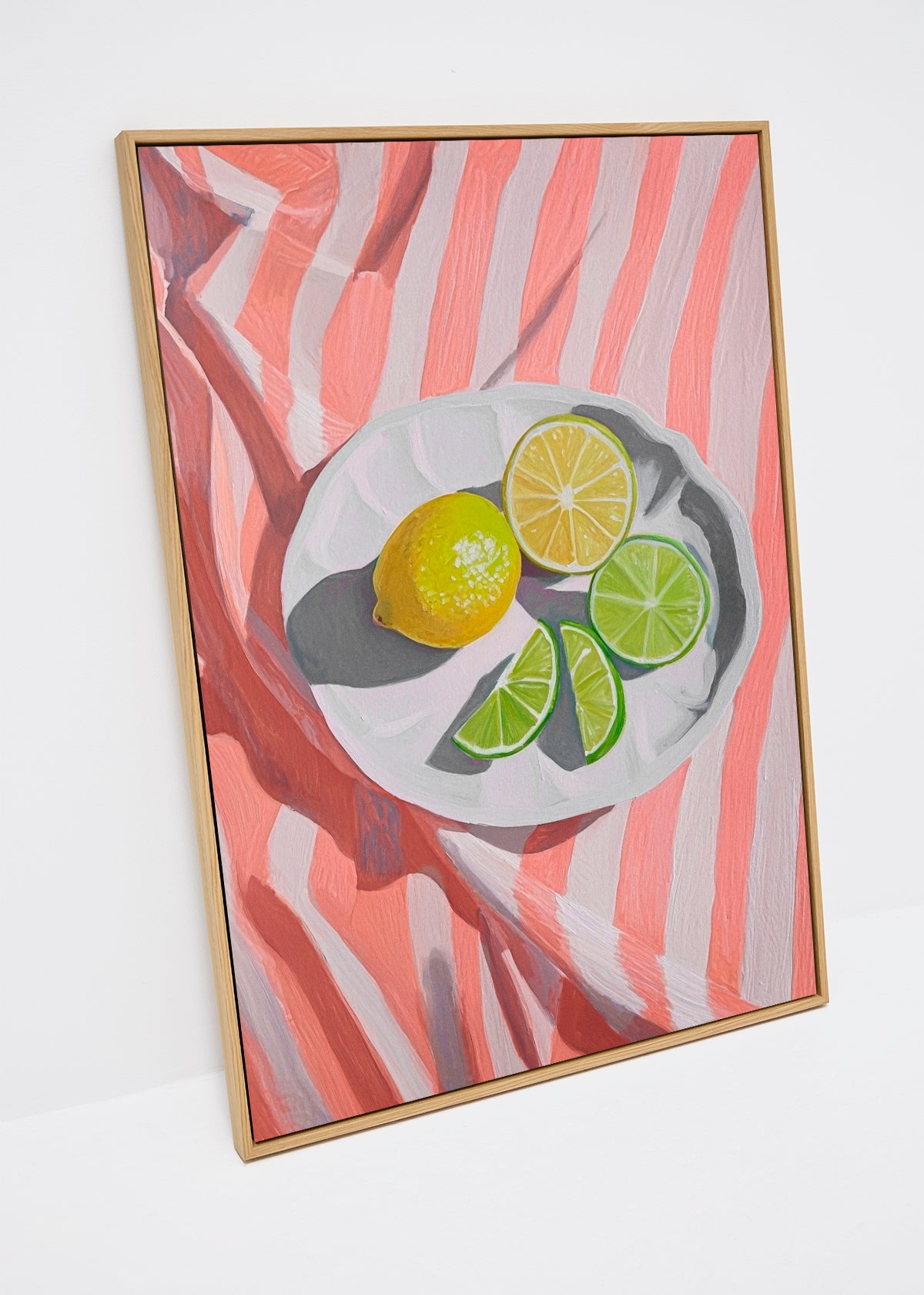 Canvas print with lemon and lime slices on red-striped fabric – Slice of Lemon by HelloPoster