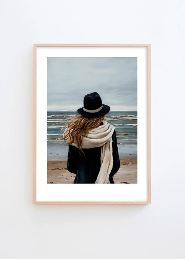 A Walk By The Sea poster in a minimalist Scandinavian interior with light grey wall and natural wood frame, featuring calm blue, beige and soft neutral coastal tones.