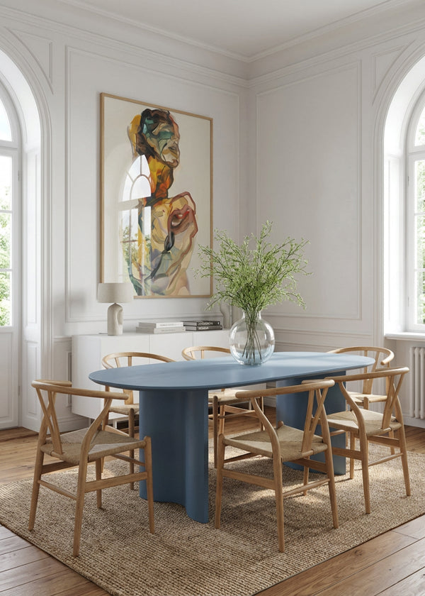 Beautiful Creature XL poster in oak frame styled in elegant Scandinavian dining room with blue oval table and natural wood chairs.