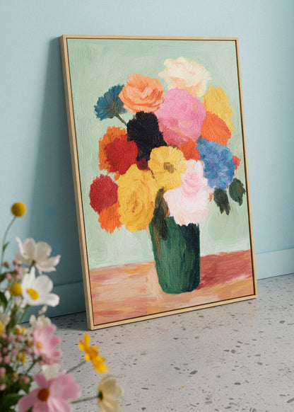 Colorful Blossoms canvas print leaning on the floor beside fresh spring flowers. Floral artwork with vibrant brushstrokes and green vase. Calm, bright interior setting. HelloPoster canvas artwork.