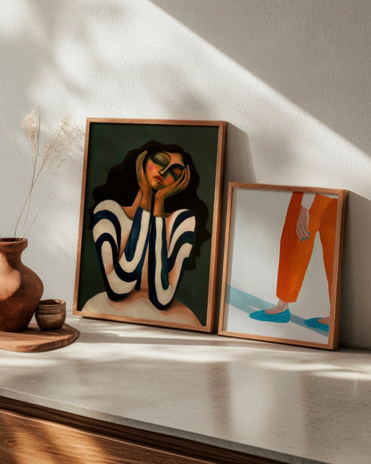 Elegant poster combination with "Daisy" and "Moody Nails," capturing contrast between soft portraiture and expressive hand-focused art in a warm setting.