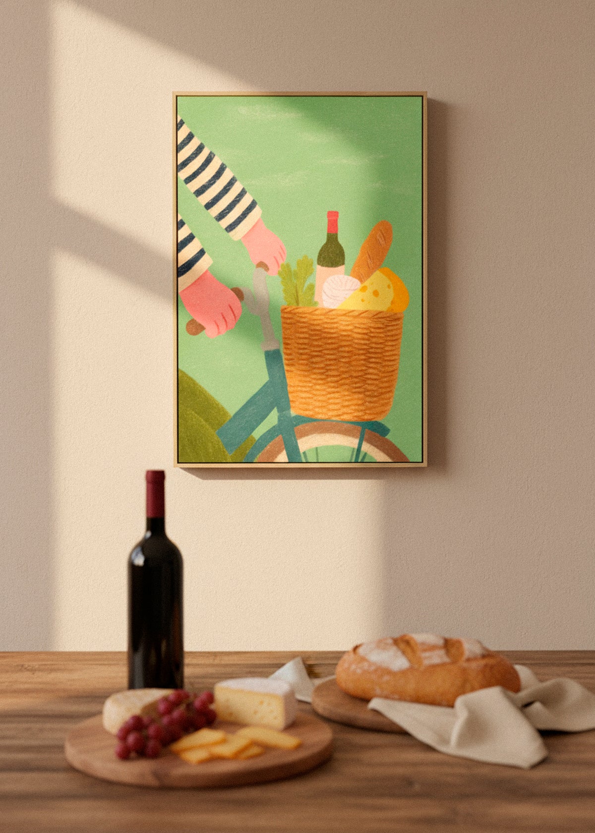 French Picnic canvas print with a bicycle basket filled with wine, bread and cheese, styled in a warm sunlit dining setting – Hello Poster