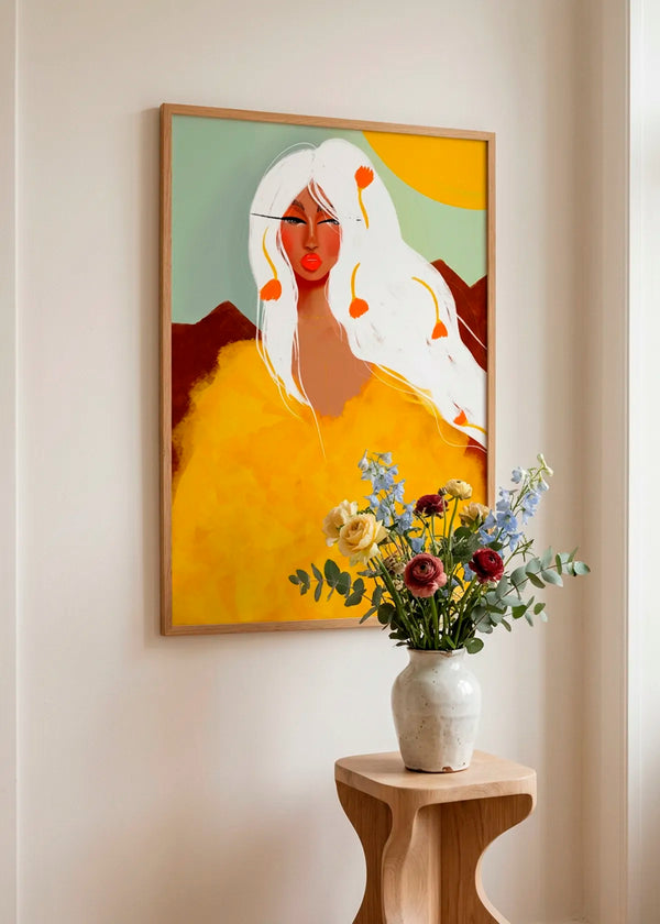 Golden Woman White Hair by Amy Straley – framed portrait art poster featuring a woman with flowing white hair and a vivid golden yellow top, styled in a bright warm interior with natural wood and flowers.