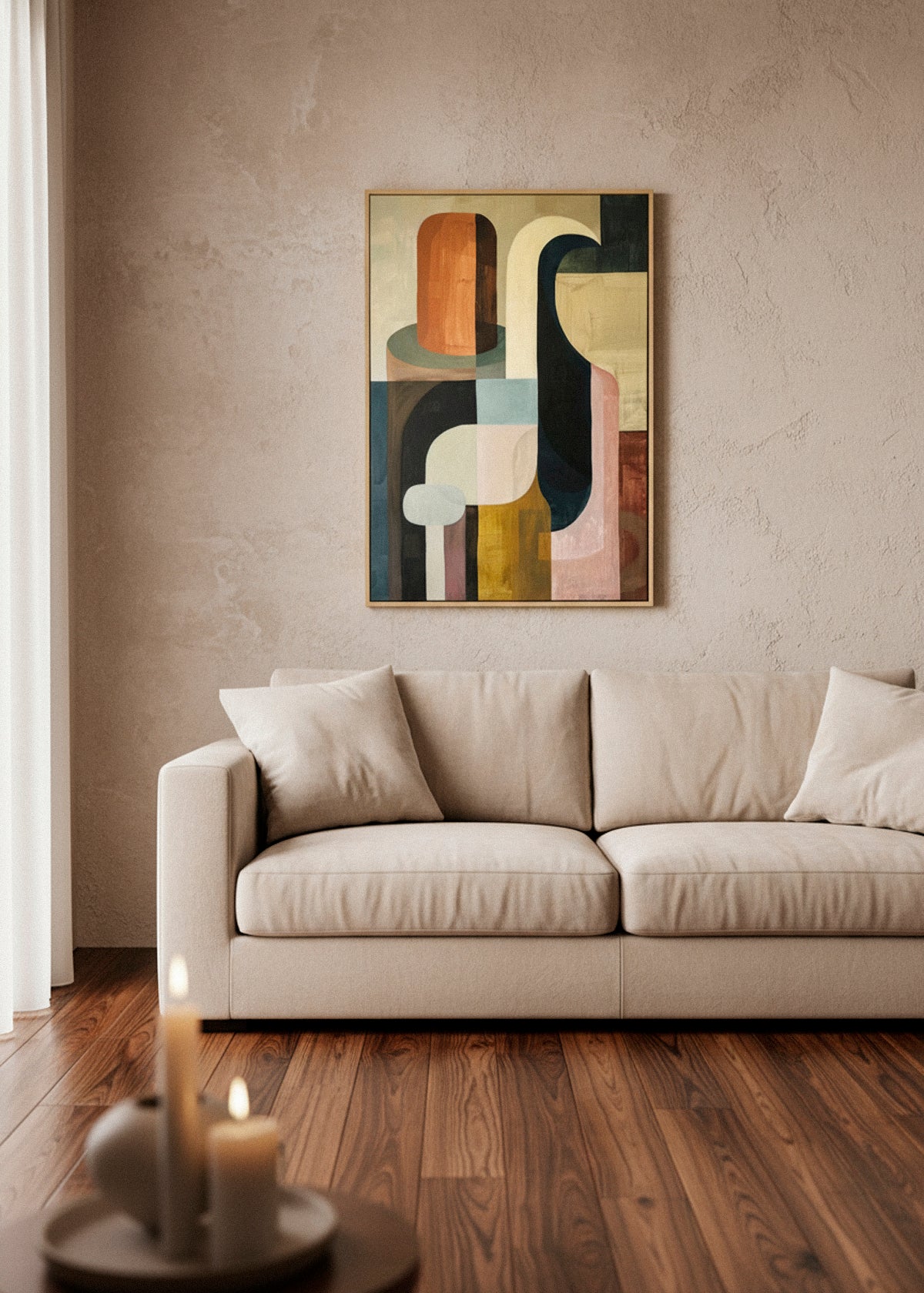 Harmonious abstract canvas art hanging above a beige sofa in a warm minimalist living room, with soft natural sunlight, wooden floors, and a neutral textured wall.