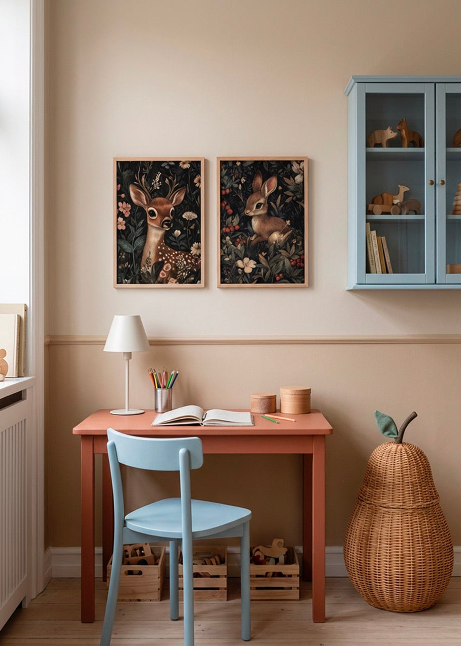 Honey Bunny and Oh Deer children’s posters in oak frames styled above small desk in cozy kids bedroom with soft Scandinavian decor.