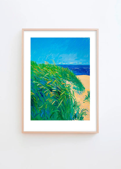 Lime Grass poster in a minimalist Scandinavian interior with light grey wall and natural wood frame, featuring vibrant green grass, sandy beige and deep blue coastal tones.