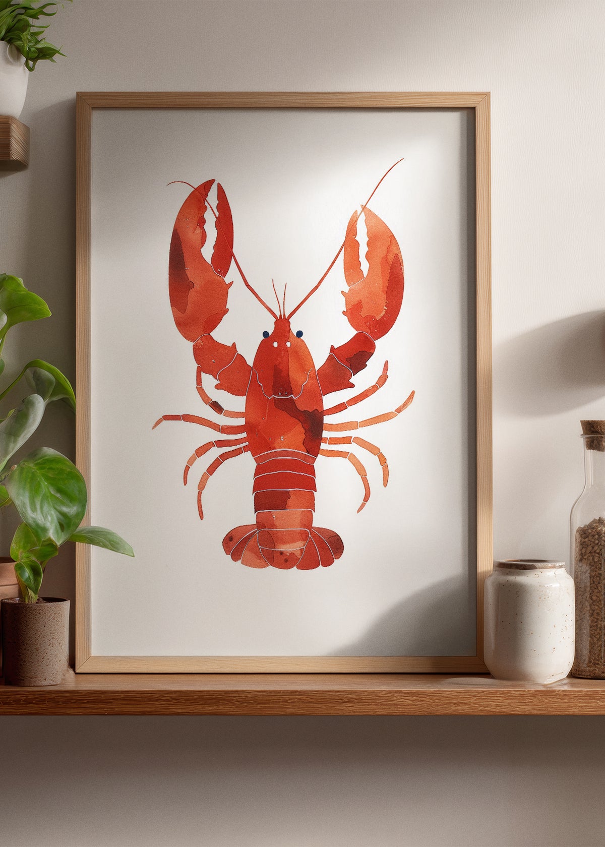 Framed Lobster Watercolor poster styled on a wooden kitchen shelf with plants and jars – vibrant red lobster art print in a cozy Nordic home interior.