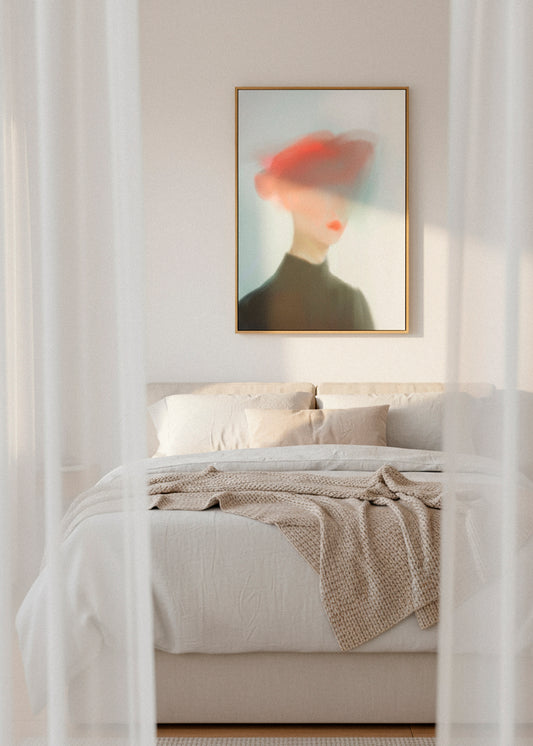 Framed “Mist” canvas print with a hazy female silhouette in warm light, displayed above white flowers on a minimalist wall.