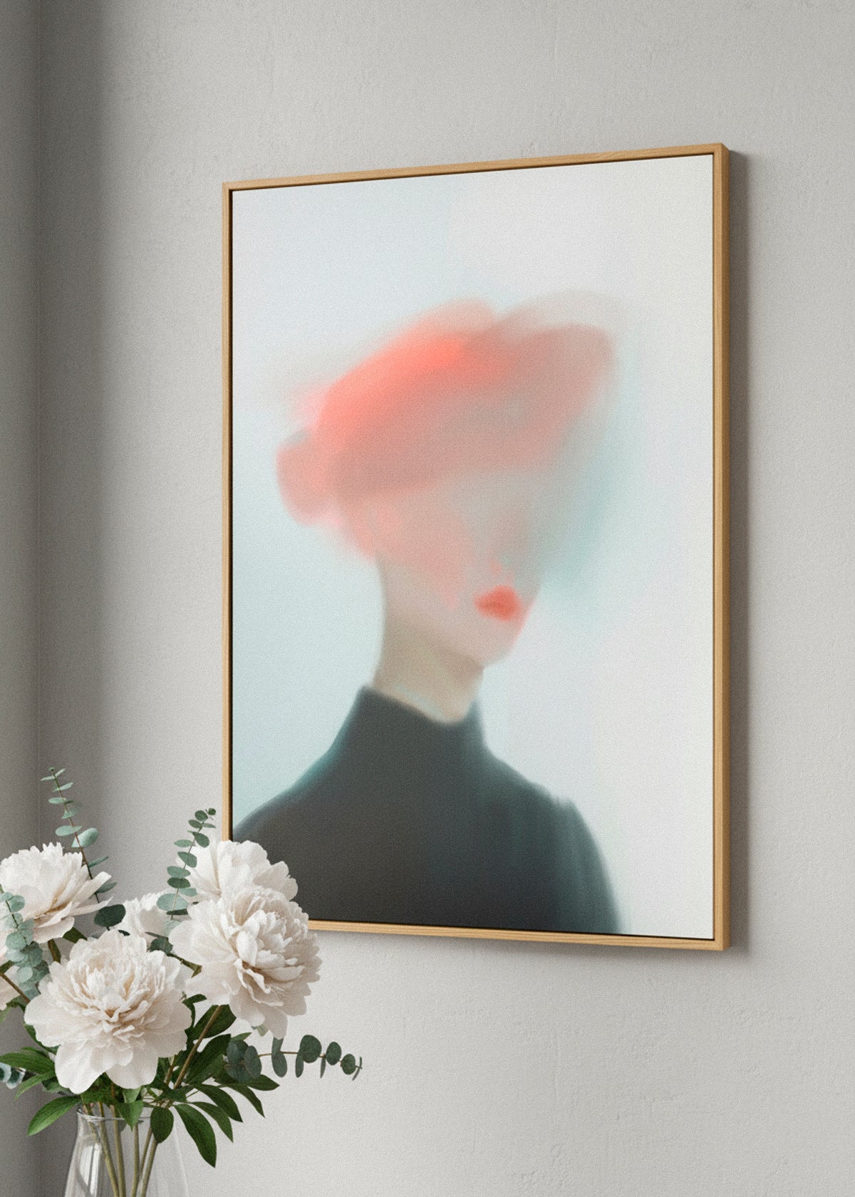 “Mist” canvas print featuring an abstract blurred portrait in red and black tones, hanging above a neutral bed with soft morning light.