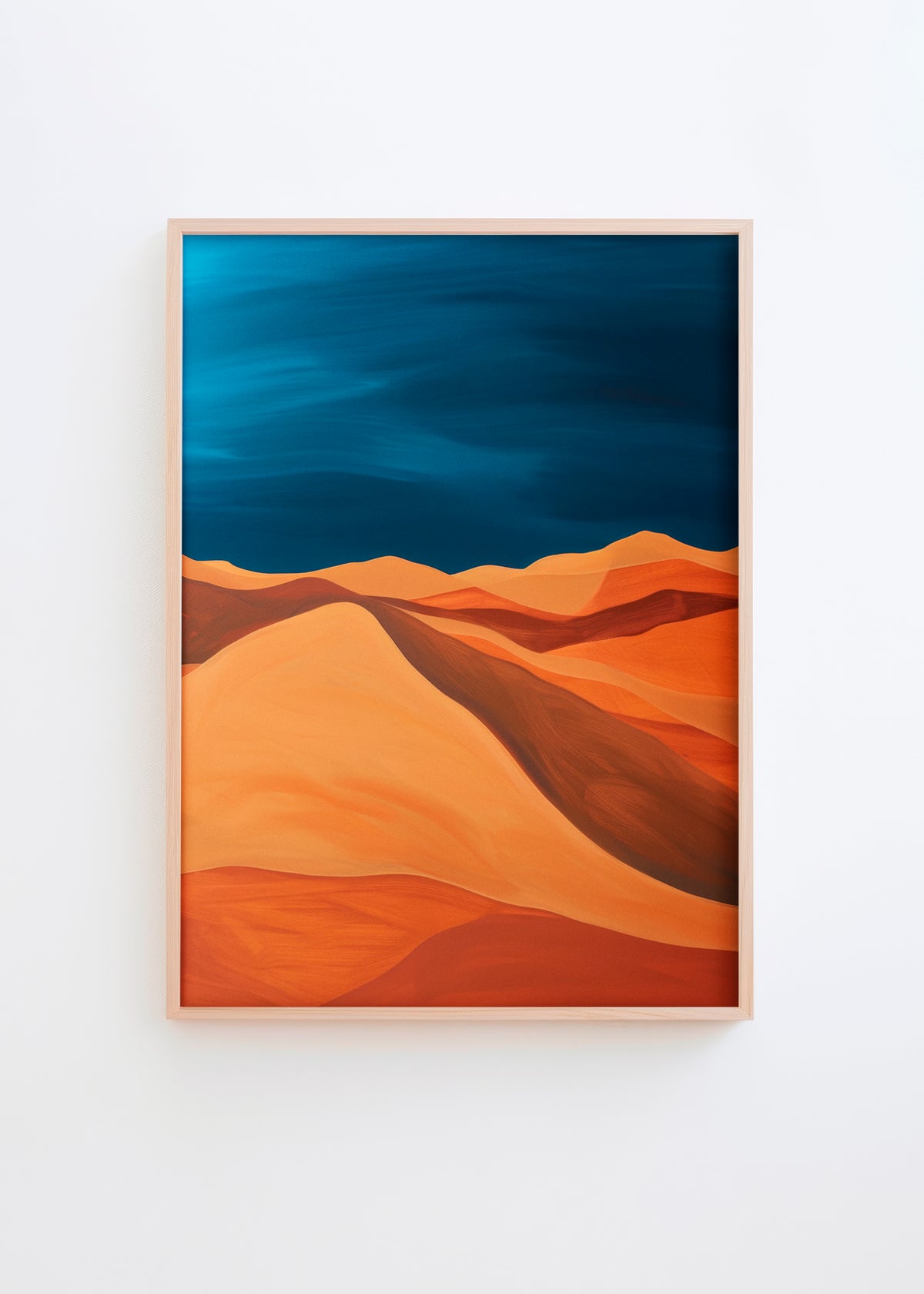 A poster titled No Man’s Land featuring warm desert dunes in shades of burnt orange and golden ochre beneath a dramatic midnight blue sky, framed in light wood.
