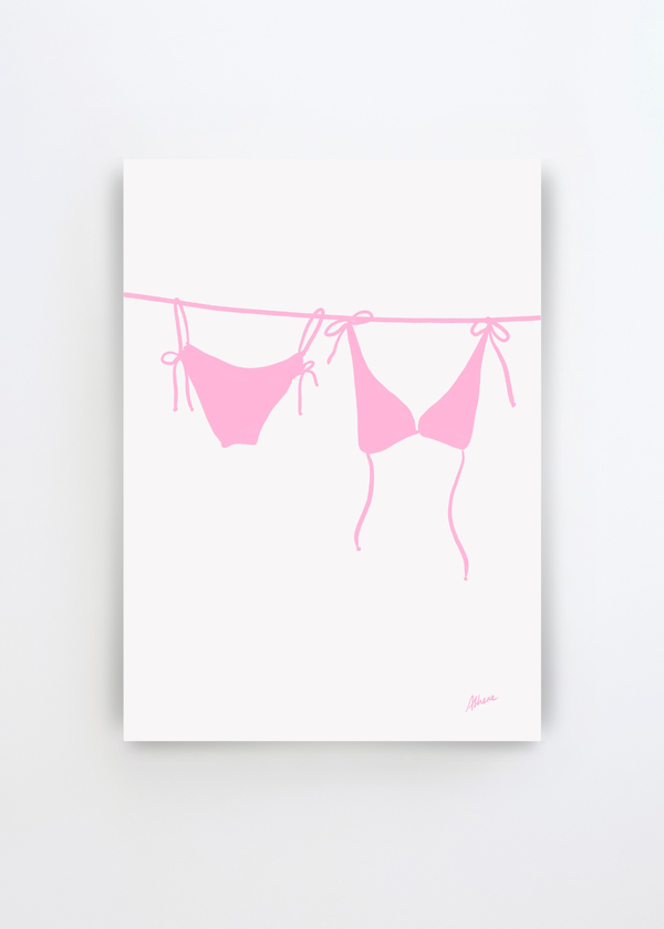 Pink Bikini by Athene Fritsch art print featuring a soft pink string bikini hanging on a line against a clean off-white background, creating a minimal and summery Scandinavian look.