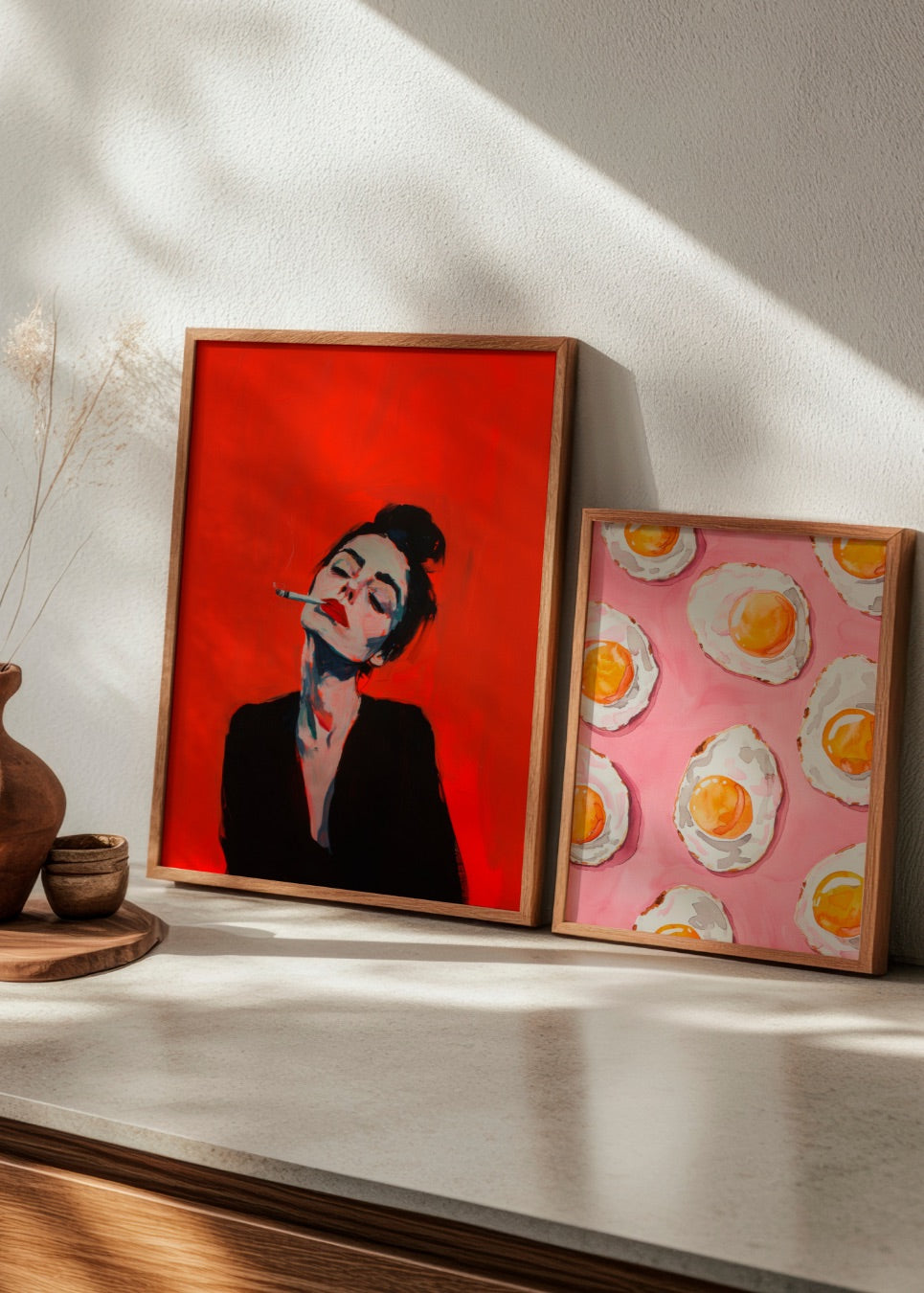 Eye-catching 'RED' poster with vibrant red tones and 'Fried' egg illustration styled playfully on a shelf.