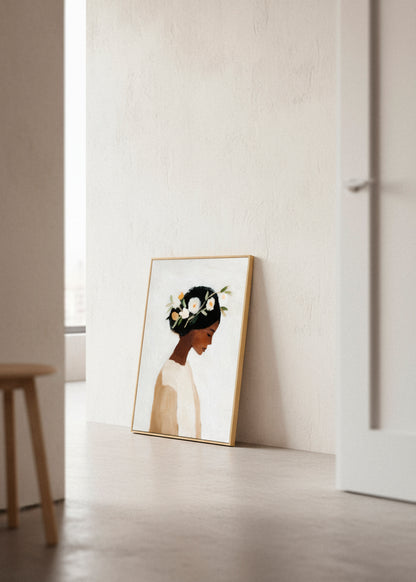 Framed “Saint” canvas print leaning against a soft beige wall in natural light, highlighting the artistic simplicity.