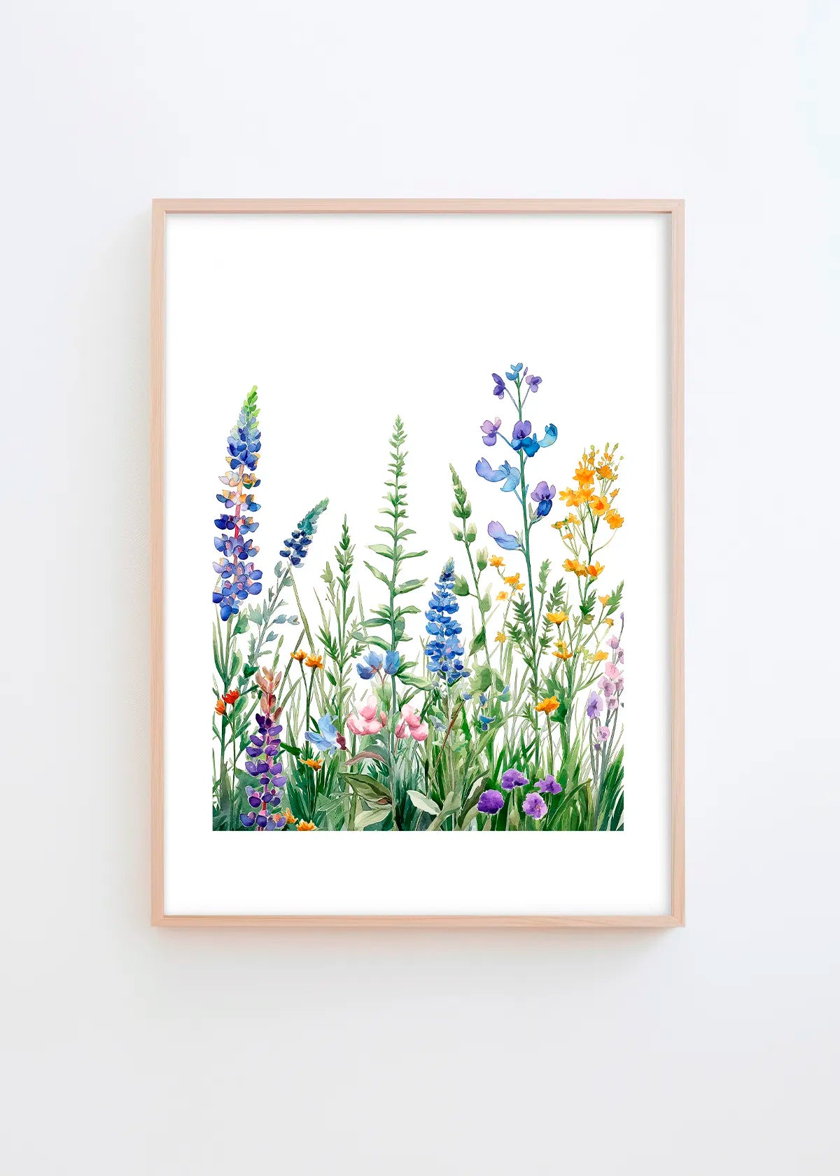 Summer Meadow poster in a minimalist Scandinavian interior with light grey wall and natural wood frame, featuring soft botanical wildflowers in blue, purple, yellow and green tones.