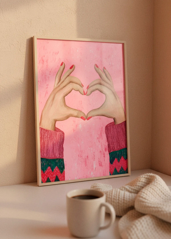 Sweater Love poster in a wooden frame leaning against a warm beige wall, styled with soft morning sunlight, cozy knit blanket and a cup of coffee.