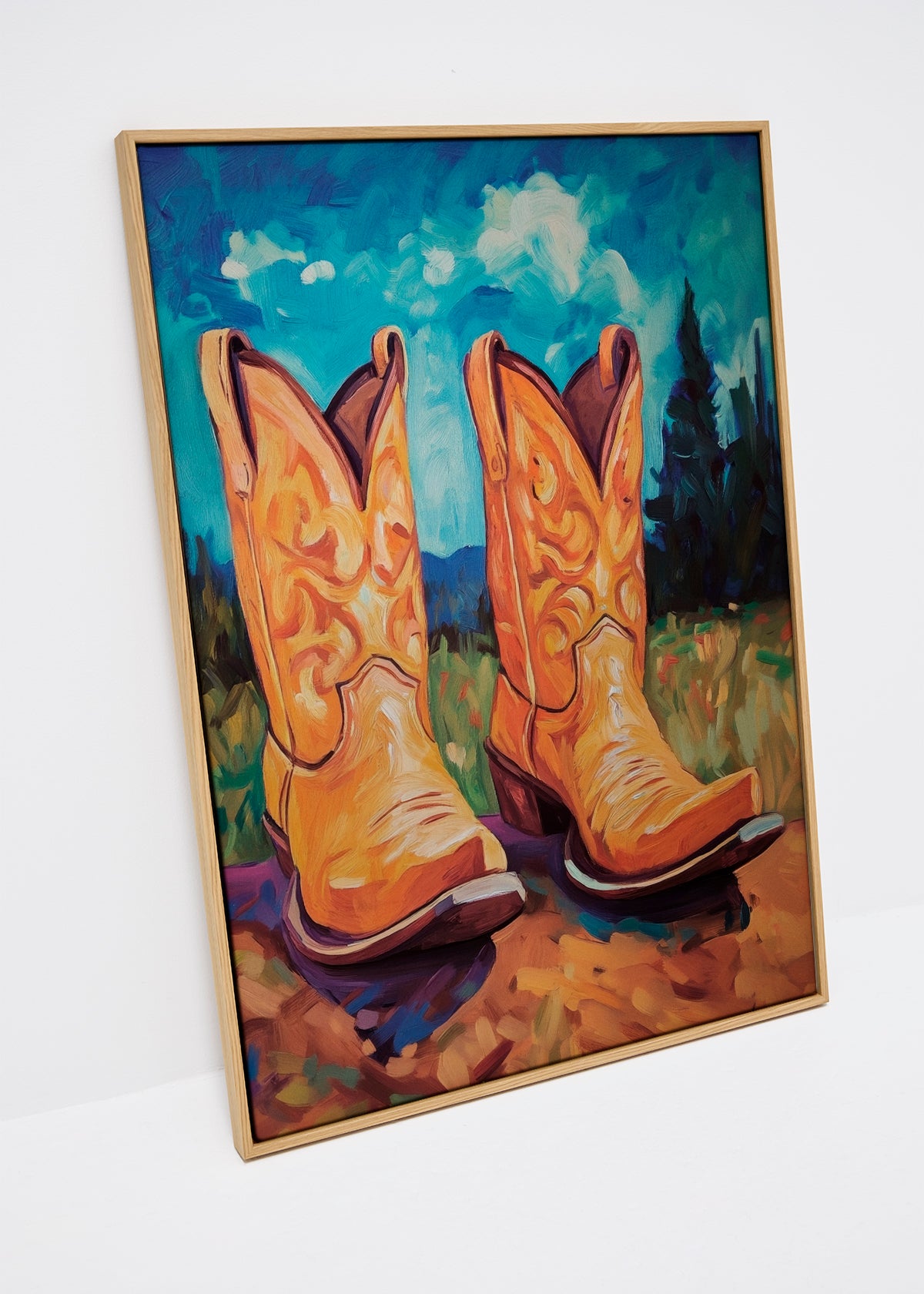 Canvas art titled "The Boot Collection – Male," featuring bold orange cowboy boots set against a vibrant blue sky, highlighting Western charm and rugged style.