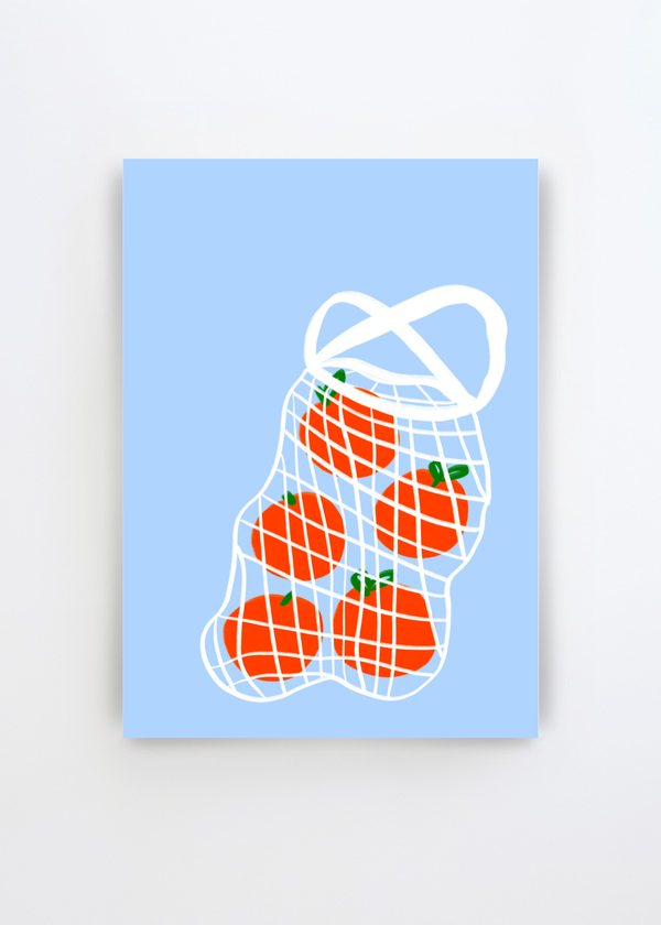Tomatoes in Mesh by Athene Fritsch art print featuring five bright red tomatoes in a white mesh shopping bag against a soft blue background, shown as a colourful graphic poster on a clean white wall.