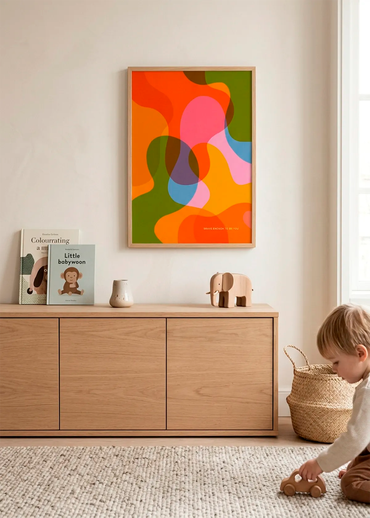 Vibrant Fluid Shapes art poster by Dominique Vari displayed in a bright kids room with warm wood furniture, soft neutral walls, toys and natural daylight.