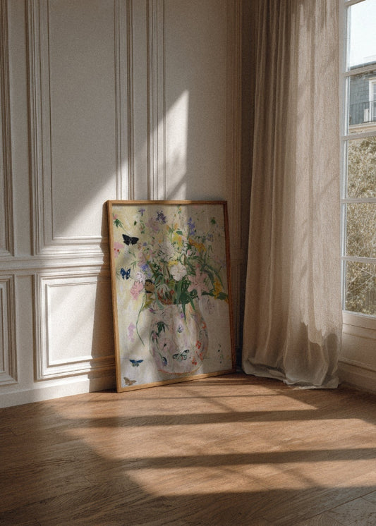 Delicate floral poster titled "Wild Garden" in soft pastels, styled in a bright, Nordic-inspired living room with neutral tones and natural textures.