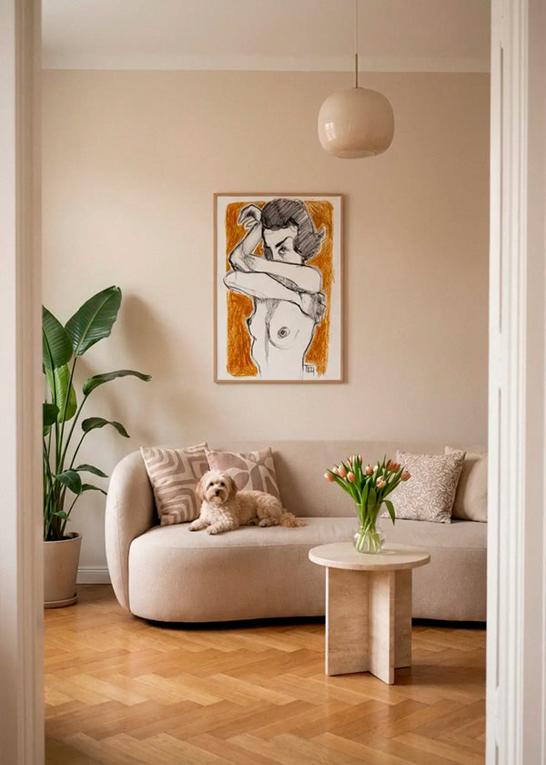 Crossed Arms poster styled above a sofa in a warm Scandinavian living room with natural wood floors